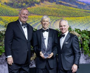 Jim Moroney III, center, accepts The Catholic Foundation Award from Matt Kramer, left, CEO of The Catholic Foundation, and Tom Yoxall, board chair, during The Catholic Foundation Award Dinner on Feb. 7 at the Hilton Anatole in Dallas. (Michael Gresham/The Texas Catholic)