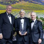 Jim Moroney III, center, accepts The Catholic Foundation Award from Matt Kramer, left, CEO of The Catholic Foundation, and Tom Yoxall, board chair, during The Catholic Foundation Award Dinner on Feb. 7 at the Hilton Anatole in Dallas. (Michael Gresham/The Texas Catholic)