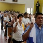 Worshippers holding candles pray during a Mass at the Metropolitan Cathedral in Managua, Nicaragua, Oct. 28, 2018, in support of Nicaraguan Auxiliary Bishop Silvio Jose Báez Ortega and to demand the release of demonstrators detained during protests against Nicaraguan President Daniel Ortega's government. (OSV News photo/Jorge Cabrera, Reuters)