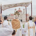 Archbishop Paul S. Coakley of Oklahoma City blesses the gathered crowd at the top of the Tepeyac Hill at the Blessed Stanley Rother Shrine in Oklahoma City during a Eucharistic procession on June 3, 2025. On March 18, 2026, the 2026 National Eucharistic Pilgrimage announced diocesan details for public stops along its East Coast route May 24-July 5 with ties to America's 250th anniversary. (OSV News photo/Avery Holt, courtesy Archdiocese of Oklahoma City)
