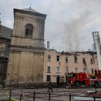 Firefighters work at the site of a residential building in Lviv, Ukraine, hit by a Russian drone strike March 24, 2026, amid Russia's massive nationwide attack on Ukraine that day. The building is adjacent to the Bernardine monastery complex and part of a UNESCO World Heritage Site. (OSV News photo/Roman Baluk, Reuters)
