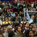 Catholics wave to Bishop Edward J. Burns as parishes are recognized during the celebration of the 40th Anniversary of the Neocatechumenal Way, on March 1, 2026 at Mood Coliseum on the campus of SMU in Dallas. Bishop Burns will offered words of welcome, presided over evening prayers, and shared a homily during the celebration.