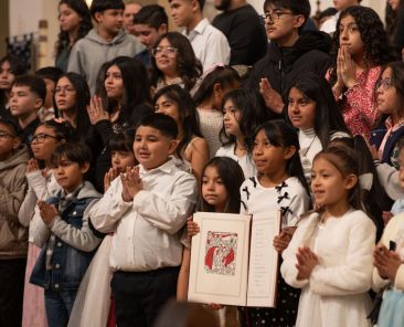 Catechumens from Good Shepherd parish are photographed with their Book of Elect after the Rite of Election Mass, on Feb. 21, 2026 at the National Shrine Cathedral of Our Lady of Guadalupe in Dallas.