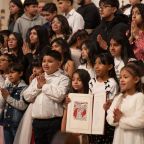 Catechumens from Good Shepherd parish are photographed with their Book of Elect after the Rite of Election Mass, on Feb. 21, 2026 at the National Shrine Cathedral of Our Lady of Guadalupe in Dallas.