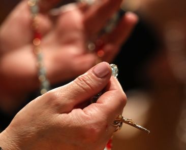 A woman prays the rosary during Eucharistic adoration following the opening Mass of the National Prayer Vigil for Life Jan. 19, 2023, at the Basilica of the National Shrine of the Immaculate Conception in Washington. (OSV News photo/Bob Roller)