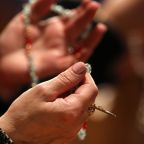 A woman prays the rosary during Eucharistic adoration following the opening Mass of the National Prayer Vigil for Life Jan. 19, 2023, at the Basilica of the National Shrine of the Immaculate Conception in Washington. (OSV News photo/Bob Roller)
