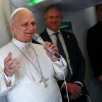Pope Leo XIV speaks to members of the media aboard the papal plane April 15, 2026, en route to Yaounde, Cameroon, amid his apostolic journey. Pope Leo spoke to journalists on the five-hour flight from Algeria to Cameroon, underlining St. Augustine's enduring importance today, saying that the saint's invitation "to search for God and to search for truth is something that is very much needed today." (OSV News photo/Guglielmo Mangiapane/Pool)
