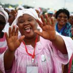 An attendee gestures during a Mass celebrated by Pope Leo XIV near Japoma Stadium in Douala, Cameroon, April 17, 2026. (OSV News photo/Guglielmo Mangiapane, Reuters)