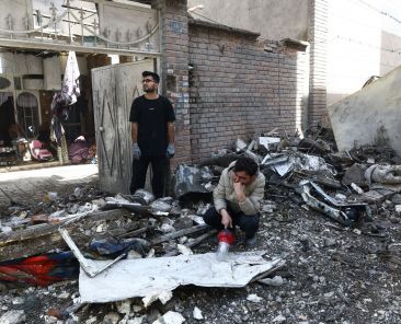 People react at the site of a residential building in Tehran, Iran, March 27, 2026, that was damaged by a strike amid the U.S.-Israeli war with Iran. (OSV News photo/Majid Asgaripour, West Asia News Agency via Reuters) EDITORS - THIS PICTURE WAS PROVIDED BY A THIRD PARTY