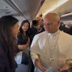 OSV News Vatican Editor Courtney Mares speaks with Pope Leo XIV aboard the papal plane to Algeria April 13, 2026. (Claudio Lavanga/OSV News photo)