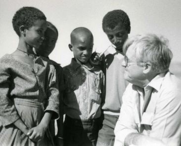 Msgr. Robert Coll, creator of the Rice Bowl Lenten initiative, speaks with youth during a Catholic Relief Services mission to African nations in this undated photo. Msgr Coll died April 20, 2026, at age 95 in Naples, Fla. (OSV News photo/courtesy Archdiocese of Philadelphia/Al and Camille St. Pierre) EDITORS: BEST QUALITY AVAILABLE.