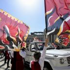 Pope Leo XIV rides in his popemobile, which passes by a group of traditional flag twirlers, during his general audience in St. Peter's Square at the Vatican April 29, 2026. (CNS photo/Vatican Media)