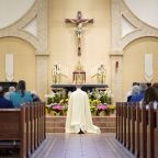 Father Rob Ketcham, pastor of Christ the King Church in Commack, N.Y., kneels before the Blessed Sacrament during a Holy Hour marking the feast of Divine Mercy April 16, 2023. (OSV News photo/Gregory A. Shemitz)