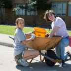 University of Dallas student (rt) Sophie Del Mazo participated in the UD Big Event service day and volunteered at Faustina Academy in Irving on Saturday morning where she helped Faustina Academy Student Kate Fontenot clean around the school building.