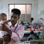A father, who has been in the hospital with his measles-free son for five days, holds his child at the Children's Hospital in Dhaka, Bangladesh, May 8, 2026. Catholic Charity Caritas Bangladesh and church-run health centers are building awareness among the rural people while the country grapples with a deadly outbreak of measles that has left more than 336 children dead since mid-March.(OSV News photo/Stephan Uttom Rozario)