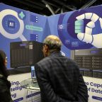 A visitor views the booth of a firm providing AI services at the Web Summit digital trade show in Vancouver, British Columbia, Canada, May 12, 2026. Pope Leo XIV’s first encyclical, "Magnifica Humanitas," will be published May 25, addressing artificial intelligence and the protection of human dignity, the Vatican announced May 18, 2026. (OSV News photo/Chris Helgren, Reuters)