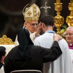 Pope Leo XIV confirms a man he baptized during the Easter Vigil in St. Peter's Basilica at the Vatican April 4, 2026. (CNS photo/Lola Gomez)