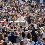 Pope Leo XIV greets visitors and pilgrims from the popemobile while riding around St. Peter’s Square at the Vatican before his weekly general audience May 20, 2026. (CNS photo/Lola Gomez)