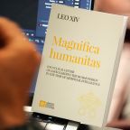 A copy of Pope Leo XIV’s first encyclical, “Magnifica Humanitas: On Safeguarding the Human Person in the Time of Artificial Intelligence,” is seen during a presentation on the document at the Vatican May 25, 2026. (CNS photo/Lola Gomez)