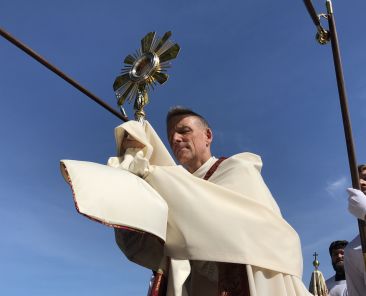 Bishop Stephen D. Parkes of Savannah carries the Blessed Sacrament ashore in St. Marys, Georgia, during the second day of the 2026 National Eucharistic Pilgrimage May 25, 2026. (OSV News photo/Anne T. Heinlein)