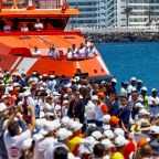 People gather as Pope Leo XIV (not pictured) makes a floral offering to migrants lost at sea at the dock of the Port of Arguineguin in Gran Canaria, Spain, June 11, 2026 during the final stretch of the pope's apostolic visit to Spain. (OSV News photo/Borja Suarez, Reuters)