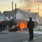 A fire burns in bins as anti-immigrant protesters clash with police at Antrim road, following a knife attack on June 8, which left a man seriously injured and prompted police to declare a critical incident, in Belfast, Northern Ireland, June 10, 2026. (OSV News photo/Isabel Infantes, Reuters)