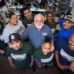 Jesuit Father Greg Boyle, founder of Homeboy Industries in Los Angeles, poses for a photo with trainees in this undated photo. The acclaimed gang-intervention program in Los Angeles has a $100 million fundraising campaign for its expansion started with an initial $10 million from Frank McCourt Jr., a billionaire Georgetown University alumnus and founder of Georgetown's McCourt School of Public Policy. The capital drive was promoted at a June 12, 2026, summit held at the McCourt School. (OSV News photo/courtesy Homeboy Industries)