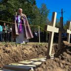 A priest conducts a mass burial ceremony of Poles killed by Ukrainian nationalists during World War II in the former Polish village of Puznyky, in Ukraine's Ternopil region, Sept. 6, 2025. In 2024, Ukraine granted Poland access to the sites in the western part of the country, once part of Poland, to carry out joint search and exhumation of the remains of Polish victims. (OSV News/Anastasiia Smolienko, Reuters)