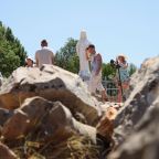 Pilgrims pray around a statue of Mary on Apparition Hill in Medjugorje, Bosnia-Herzegovina, July 3, 2025. Authorities were investigating a string of early-morning vandalism and arson attacks at Medjugorje July 28, 2026. Police said several statues of the Virgin Mary were defaced with black spray paint and blasphemous graffiti. (OSV News photo/Amel Emric, Reuters)
