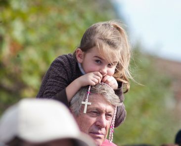 People join in praying the rosary during the Family Rosary Crusade at Civic Center Plaza in San Francisco in mid-October. An estimated 1,500 people attended the annual event, a small fraction of the 550,000 who thronged to Golden Gate Park when Father Patrick Peyton inaugurated the event 50 years ago. (CNS photo/Jose Luis Aguirre, Catholic San Francisco) (Oct. 26, 2011) See ROSARY CRUSADES Oct. 26, 2011.