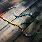 A World Mission Rosary, seen in a file photo, is identified by the color-coded decades that represent the five mission territories of Africa, Oceania, Europe, the Americas and Asia. The World Mission Rosary was designed by Venerable Fulton J. Sheen, who served as national director of the Pontifical Mission Societies. On May 1, 2026, the mission organization issued a call for rosaries, asking individuals and groups to make and donate 1,000 or more rosaries to reach of goal of more that 70,000, which will be given to those who attend the beatification of Archbishop Sheen Sept. 24. (OSV News/Margaret Murray)