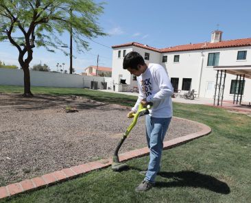 Mark Salgado, 18, of Phoenix, then-a first-year seminarian, trims the lawn outside Nazareth Seminary in Phoenix April 11, 2025. Released July 17, 2026, a new report highlights the growing mental health challenges that seminarians face and the need for better psychological care in seminaries; it also calls for bishops to focus on quality of seminarians, rather than number of men in formation for their dioceses. (OSV News photo/Bob Roller)