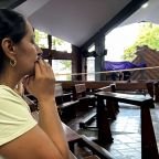 A woman prays inside a Catholic church that was damaged during an earthquake, in Cali, Colombia, Aug. 10, 2026. The Catholic bishops of Colombia are calling for national unity and urgent aid after the 7.4-magnitude earthquake struck the country, killing at least 132 people and injuring over 570. (OSV News photo/Marco Trujillo, Reuters) Editors: Picture taken with a mobile phone.