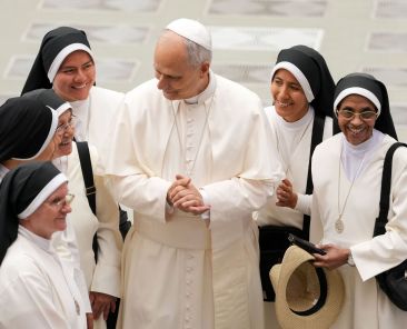 Pope Leo XIV greets religious sisters in the Paul VI Audience Hall at the conclusion of his weekly general audience at the Vatican Aug. 13, 2025. In a video message sent Aug. 12, 2026, to the Leadership Conference of Women Religious assembly in Orlando, Fla., Pope Leo encouraged sisters to foster vocations to religious life in the United States. (CNS photo/Lola Gomez)