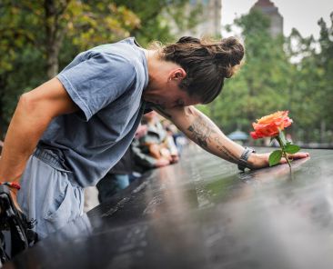 Elizabeth Adams reacts at the 9/11 Memorial & Museum reflecting pool in the Manhattan borough of New York City, Sept. 10, 2025, ahead of the 24th anniversary of the Sept. 11, 2001, attacks on the World Trade Center. Twenty-five years after the 9/11 terrorism attacks that claimed the lives of nearly 3,000 people, Catholic family members who lost loved ones that day have credited their faith with getting through the losses. (OSV News photo/Jeenah Moon, Reuters)