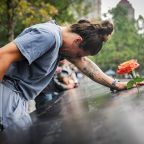 Elizabeth Adams reacts at the 9/11 Memorial & Museum reflecting pool in the Manhattan borough of New York City, Sept. 10, 2025, ahead of the 24th anniversary of the Sept. 11, 2001, attacks on the World Trade Center. Twenty-five years after the 9/11 terrorism attacks that claimed the lives of nearly 3,000 people, Catholic family members who lost loved ones that day have credited their faith with getting through the losses. (OSV News photo/Jeenah Moon, Reuters)