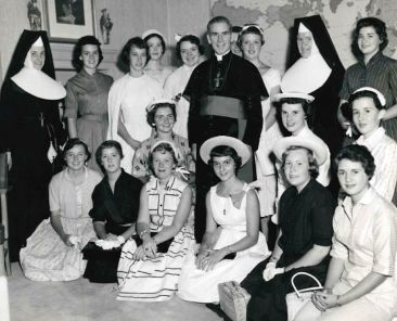 Archbishop Fulton J. Sheen is seen in an undated photo posing with women who worked at the Society for the Propagation of the Faith in New York City. (OSV News photo/Pontifical Mission Societies USA Archives)