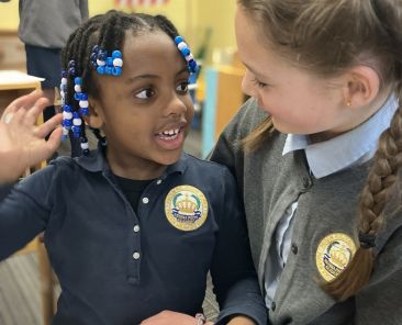 Students are seen in a May 22, 2025, photo, engaging in the classroom at Regina Pacis Academy in Norwalk, Conn. Regina Pacis Academy, a preschool-to-eighth-grade independent Catholic school, was founded as a tech-free classical school. Instead of smartboards, devices and a computer lab, the academy has chalkboards, textbooks and a well-stocked library, said Kimberly Quatela, its principal.  (OSV News photo/courtesy Regina Pacis Academy)