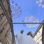 Pope Leo XIV looks up and greets people waving from their balcony during a halfday visit to Rimini, Italy, Aug. 22, 2026. (CNS photo/Vatican Media)