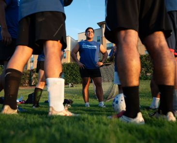 Player coach Edgar Rodriguez, speaks to members of Divine Strikers, of Divine Mercy in Mesquite, before the start of their game vs Insieme in Cristo at the campus of the University of Dallas in Irving, on Friday, August 14, 2026.