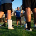 Player coach Edgar Rodriguez, speaks to members of Divine Strikers, of Divine Mercy in Mesquite, before the start of their game vs Insieme in Cristo at the campus of the University of Dallas in Irving, on Friday, August 14, 2026.