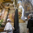 Pope Leo XIV unveils a mural high up in the Basilica Shrine of Our Lady of Good Counsel in Genazzano, Italy, southeast of Rome, Sept. 7, 2027, on the eve of the feast of the Nativity of the Blessed Virgin Mary. The mural, unveiled before the pope celebrated Mass, depicts the Augustinian pontiff kneeling before the Marian image. (OSV News photo/Simone Risoluti, Vatican Media)