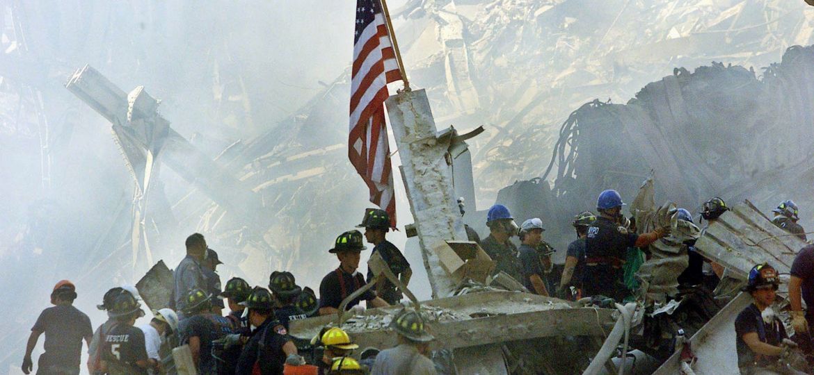 2001 FILE U.S. FLAG STANDING AMID WORLD TRADE RUBBLE