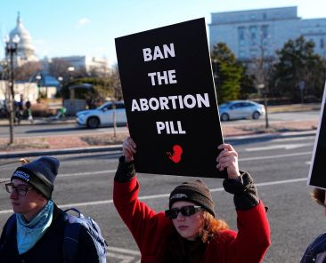 Demonstrators hold signs during a protest outside the U.S. Department of Health and Human Services in Washington Jan. 22, 2026, calling on President Donald Trump's administration to ban the abortion pill. In a Sept. 29, statement, Bishop Daniel E. Thomas of Toledo, Ohio, chairman of the U.S. bishops' pro-life committee, urged the faithful to mark Respect Life Month with prayer for an end to abortion and action to stop use of the abortion pill. (OSV News photo/Aaron Schwartz, Reuters)