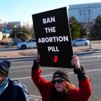 Demonstrators hold signs during a protest outside the U.S. Department of Health and Human Services in Washington Jan. 22, 2026, calling on President Donald Trump's administration to ban the abortion pill. In a Sept. 29, statement, Bishop Daniel E. Thomas of Toledo, Ohio, chairman of the U.S. bishops' pro-life committee, urged the faithful to mark Respect Life Month with prayer for an end to abortion and action to stop use of the abortion pill. (OSV News photo/Aaron Schwartz, Reuters)
