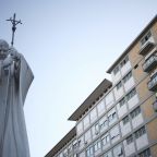 A statue of the St. John Paul II is seen outside Gemelli Hospital in Rome Oct. 13, 2026, where Pope Leo XIV is having surgery that afternoon to remove a lung nodule. (OSV News photo/Matteo Minnella, Reuters)