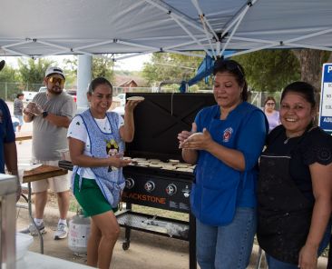 St. Mary of Carmel School in Dallas celebrated the Jamaica Festival on Sunday afternoon.  (l-r) Juan Ruiz, Noelia Medellin, Juana Ruiz and Maria Gonzalez prepared gorditas at the Gordita Stand.